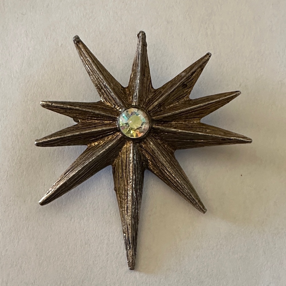 Elegant Silver Starburst Brooch